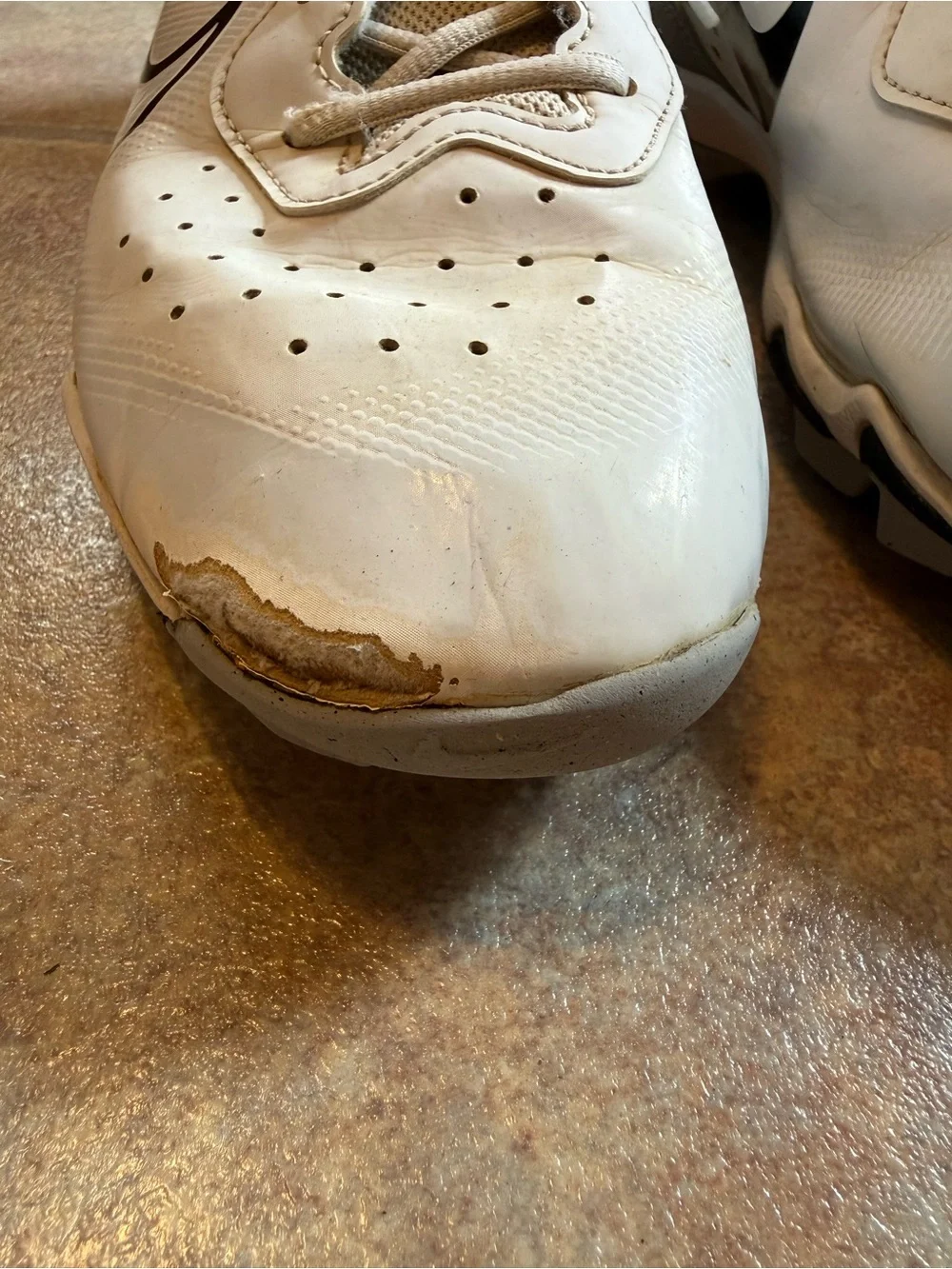 Nike White Cleats with Black Swoosh and Silver Accents